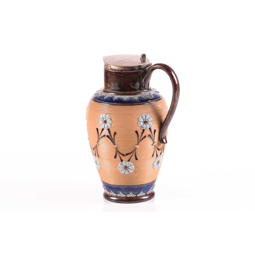 217 - A late 19th century Doulton Lambeth stoneware water jug, with a hinged silver cover bearing a presen... 