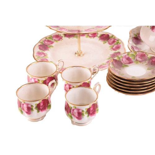 218 - A Royal Albert 'Old English Rose' teaset, comprising a large teapot, three-tier cake stand, a cake p... 