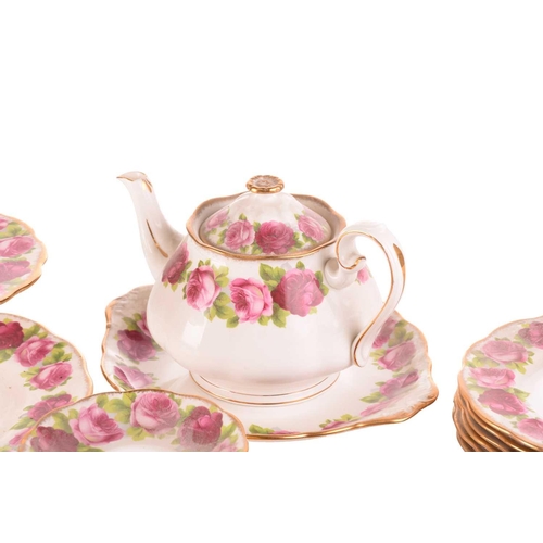 218 - A Royal Albert 'Old English Rose' teaset, comprising a large teapot, three-tier cake stand, a cake p... 