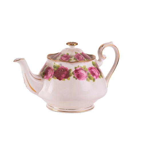 218 - A Royal Albert 'Old English Rose' teaset, comprising a large teapot, three-tier cake stand, a cake p... 