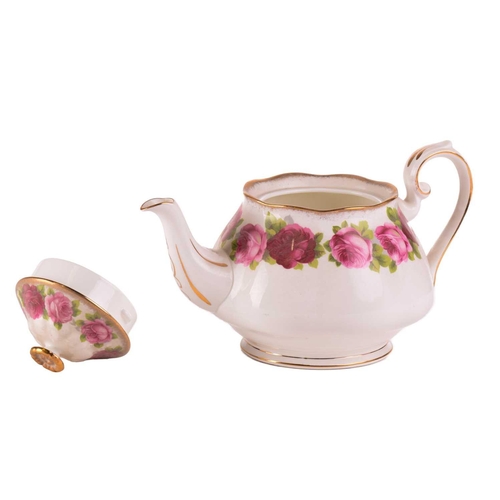 218 - A Royal Albert 'Old English Rose' teaset, comprising a large teapot, three-tier cake stand, a cake p... 