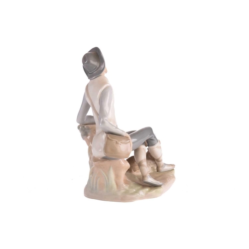 220 - Two Lladro figural table lamp bases, each modelled with a girl holding a basket, 39 cm high, togethe... 