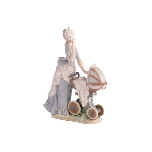 221 - A group of five large Lladro figures, to include a mother with pram, a boy with a dog and others, th... 