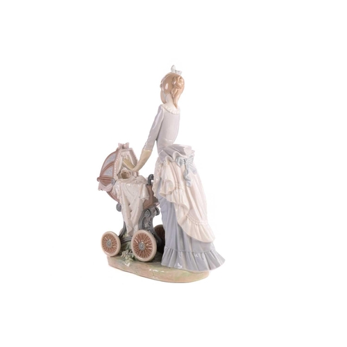 221 - A group of five large Lladro figures, to include a mother with pram, a boy with a dog and others, th... 