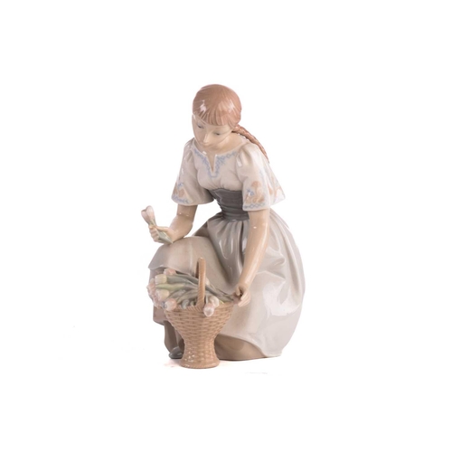 221 - A group of five large Lladro figures, to include a mother with pram, a boy with a dog and others, th... 