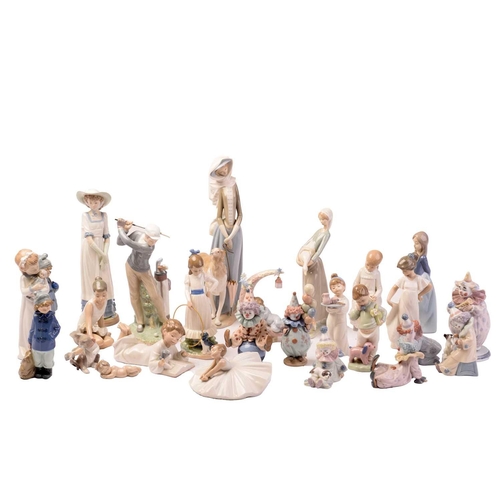 228 - A large collection of Lladro and Nao figurines, the majority boxed.Appear well-looked after and unda... 