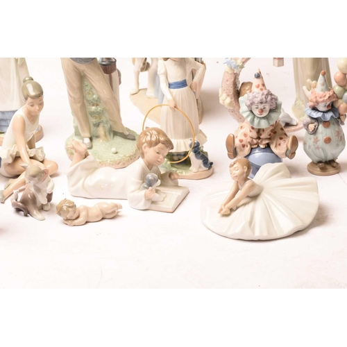 228 - A large collection of Lladro and Nao figurines, the majority boxed.Appear well-looked after and unda... 