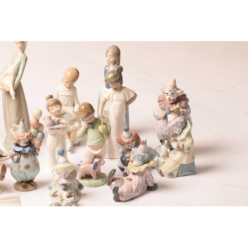 228 - A large collection of Lladro and Nao figurines, the majority boxed.Appear well-looked after and unda... 