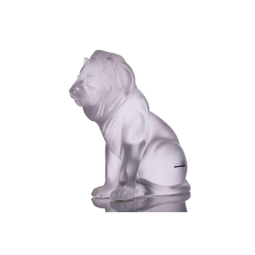 236 - A Lalique 'Bamara' frosted glass sculpture of a lion seat on his haunches. 20 cm high x 17 cm long x... 