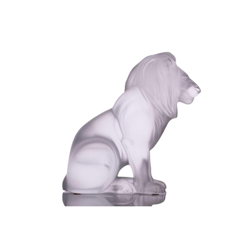 236 - A Lalique 'Bamara' frosted glass sculpture of a lion seat on his haunches. 20 cm high x 17 cm long x... 