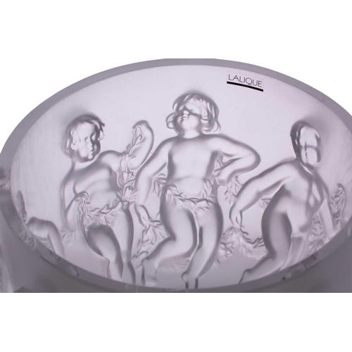 237 - A Lalique 'Luxembourg' centre bowl moulded with cherubs holding swags of flowers. 32 cm overall widt... 