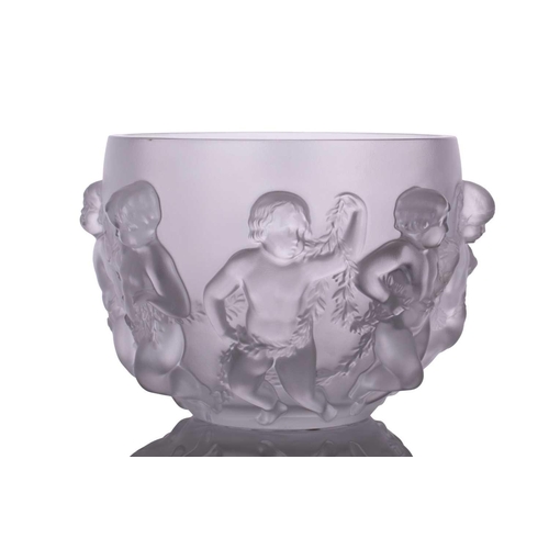 237 - A Lalique 'Luxembourg' centre bowl moulded with cherubs holding swags of flowers. 32 cm overall widt... 