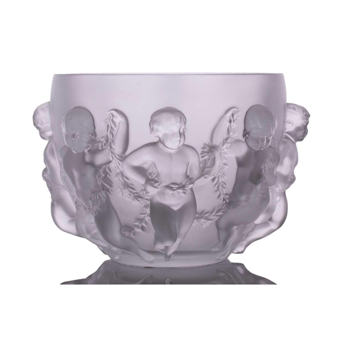 237 - A Lalique 'Luxembourg' centre bowl moulded with cherubs holding swags of flowers. 32 cm overall widt... 