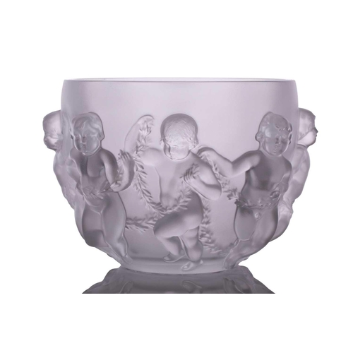 237 - A Lalique 'Luxembourg' centre bowl moulded with cherubs holding swags of flowers. 32 cm overall widt... 