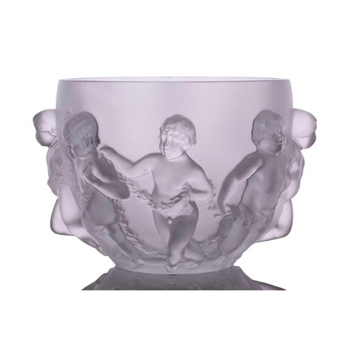 237 - A Lalique 'Luxembourg' centre bowl moulded with cherubs holding swags of flowers. 32 cm overall widt... 