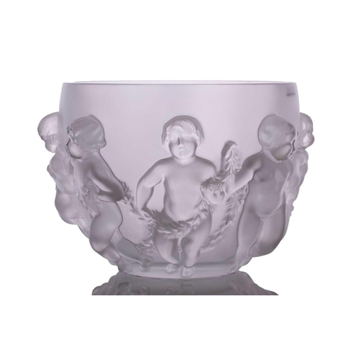 237 - A Lalique 'Luxembourg' centre bowl moulded with cherubs holding swags of flowers. 32 cm overall widt... 