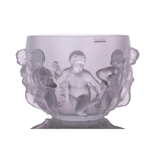 237 - A Lalique 'Luxembourg' centre bowl moulded with cherubs holding swags of flowers. 32 cm overall widt... 