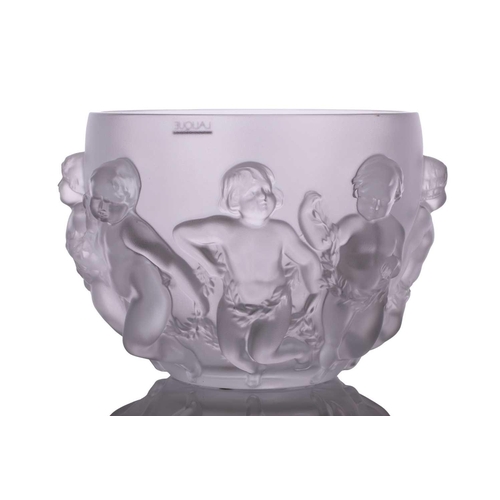 237 - A Lalique 'Luxembourg' centre bowl moulded with cherubs holding swags of flowers. 32 cm overall widt... 