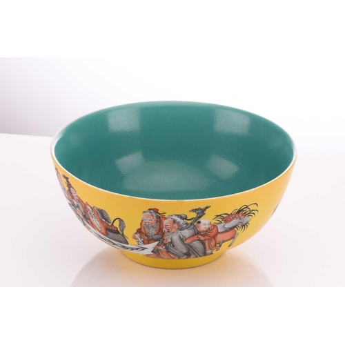 58 - A Chinese porcelain bowl, painted with scholars reading scroll with boy attendants, on a yellow grou... 