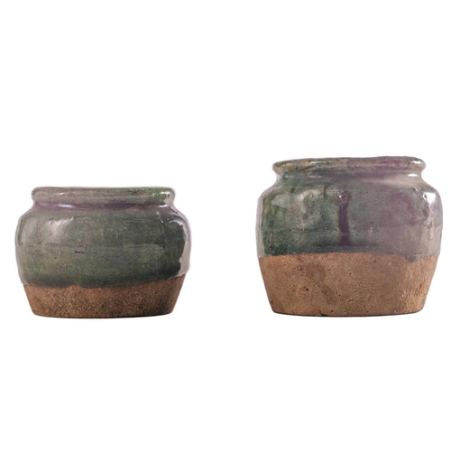 72 - Four Sawankhalok celadon food/storage jars, two jars with ribbed decoration, a further jar with impr... 