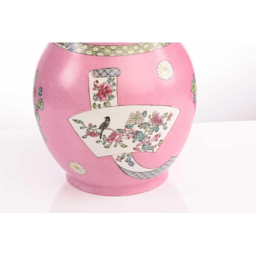 74 - A porcelain pink ground vase and cover, with pineapple type finial above the cover and vase both dec... 