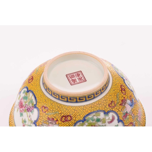 76 - A Chinese porcelain bowl, painted with medallions of auspicious flowers and flanked by treasures, al... 