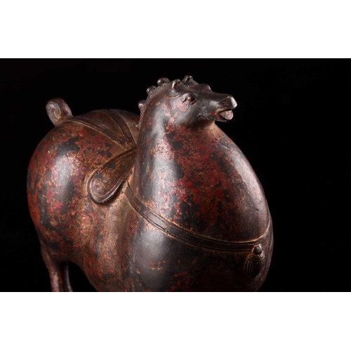 77 - A Chinese Tang Dynasty style bronze figure of an obese horse, with dressed mane and tail, fitted wit... 