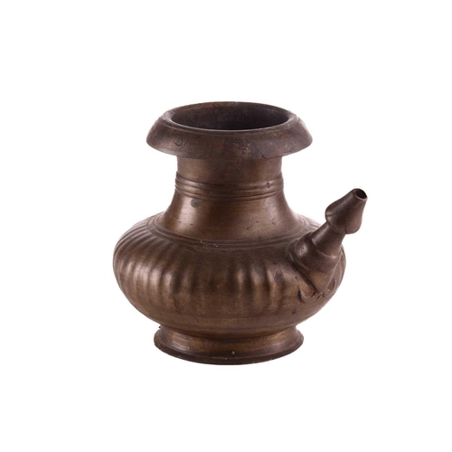 80 - An Indian Kamandal with short spout and compressed ribbed body, the shoulder with engraved character... 