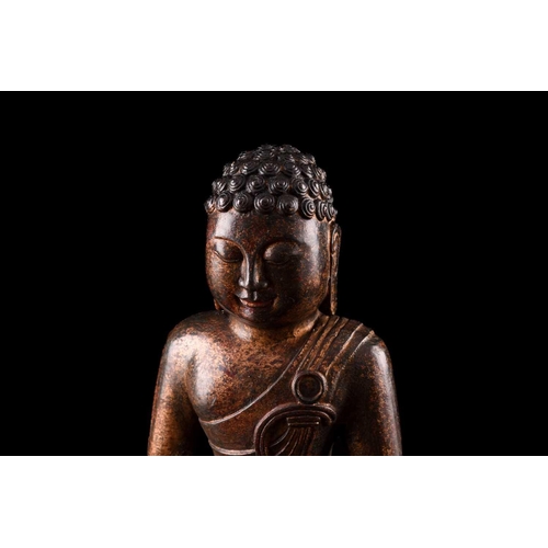 86 - A Chinese bronze figure of Buddha, seated in dhyana mudra, the hair in tight curls, traces of gildin... 