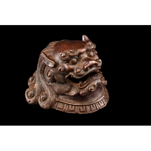 91 - A Chinese bronze censer in the form of a temple lion, with scrolling mane and tail, the chest with p... 