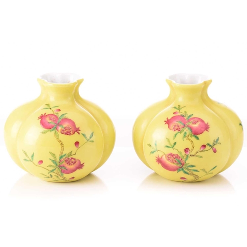 95 - A pair of Chinese porcelain tri-lobed vases, painted with pomegranates and peaches against a yellow ... 