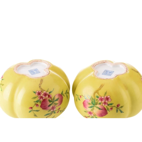 95 - A pair of Chinese porcelain tri-lobed vases, painted with pomegranates and peaches against a yellow ... 