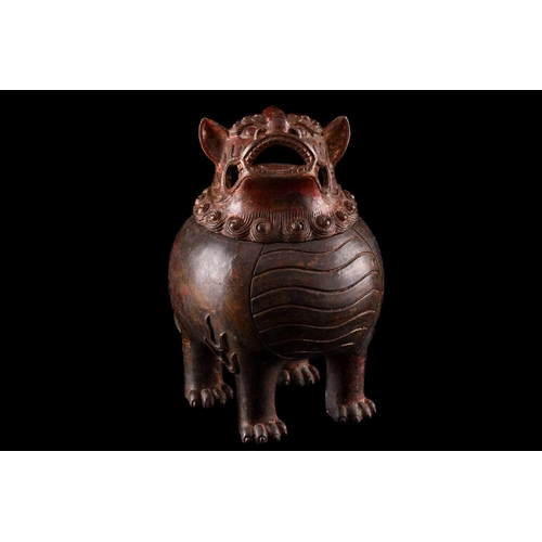 99 - A Chinese bronze censer in the form of an obese Pixiu, with scrolling mane and short tail, with flam... 