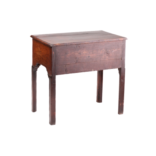 130A - A George II/III mahogany kneehole lowboy with three short drawers over a shaped frieze on shaped squ... 