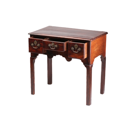 130A - A George II/III mahogany kneehole lowboy with three short drawers over a shaped frieze on shaped squ... 