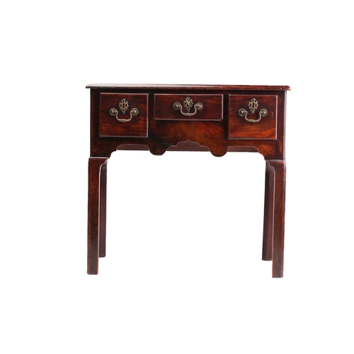 130A - A George II/III mahogany kneehole lowboy with three short drawers over a shaped frieze on shaped squ... 