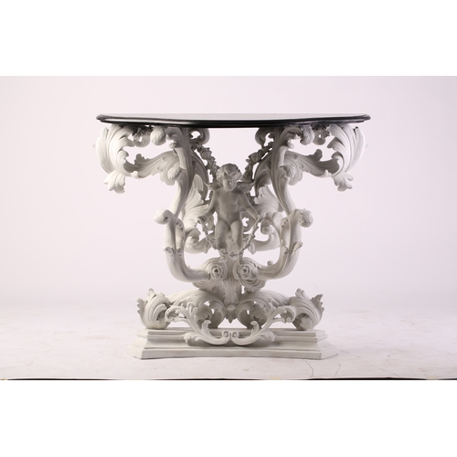 109 - An impressive white-painted and carved composition Baroque console table and wall mirror with a prof... 