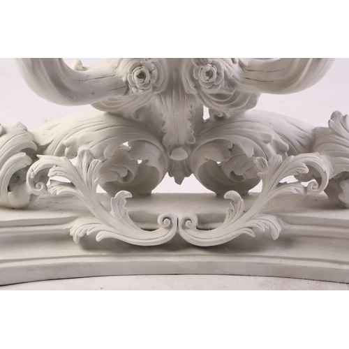 109 - An impressive white-painted and carved composition Baroque console table and wall mirror with a prof... 