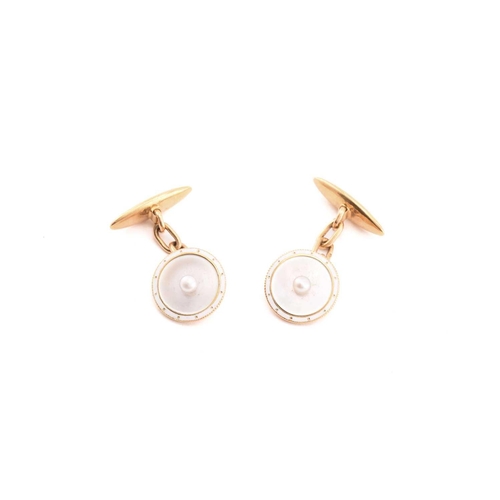 11 - A mother of pearl and pearl dress set in 18ct gold, of circular design, concave mother of pearl disc... 