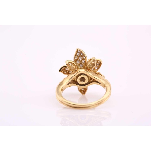 20 - An 18ct gold sapphire and diamond flower ring, comprises an oval sapphire cabochon with a high dome,... 