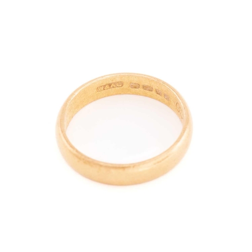 21 - A 22ct gold wedding band and a 9ct gold ring; a plain D-section band in 22ct yellow gold, London hal... 