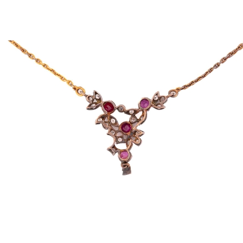 24 - A diamond and ruby necklace, with four round faceted rubies and diamond accents interspersing on mou... 