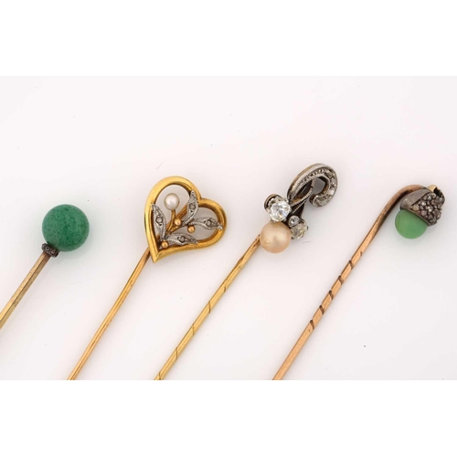 27 - Four gem-set stick pins; A heart-shaped stick pin with foliate details and pearl highlight, French e... 