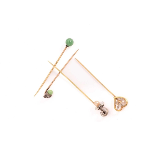 27 - Four gem-set stick pins; A heart-shaped stick pin with foliate details and pearl highlight, French e... 