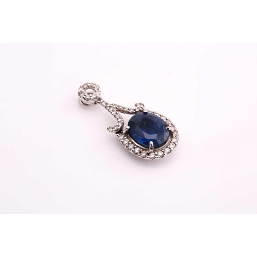 3 - A sapphire and diamond pendant, consisting of an oval sapphire with deep blue body colour and modifi... 