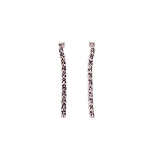 31 - A pair of diamond line drop earrings, each has a dangling enhancing part detachable from the studs, ... 