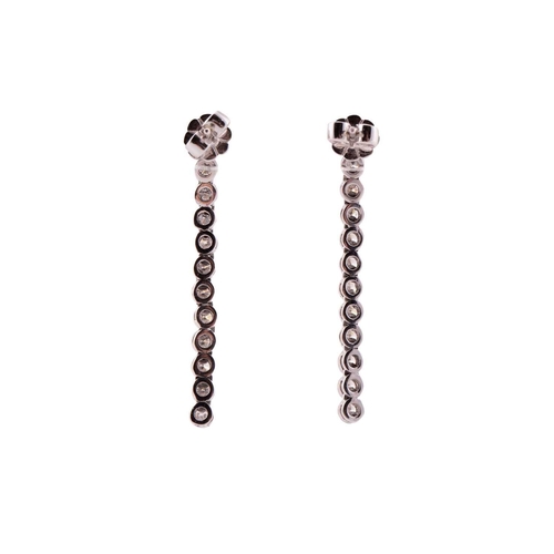 31 - A pair of diamond line drop earrings, each has a dangling enhancing part detachable from the studs, ... 