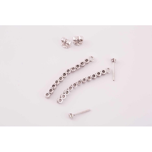 31 - A pair of diamond line drop earrings, each has a dangling enhancing part detachable from the studs, ... 