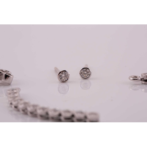 31 - A pair of diamond line drop earrings, each has a dangling enhancing part detachable from the studs, ... 