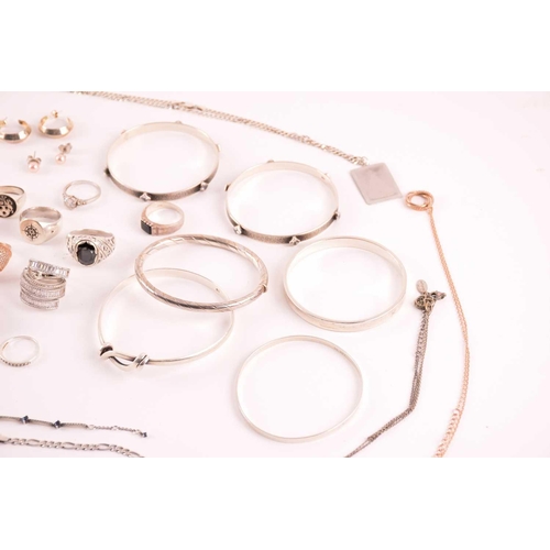 38 - A collection of silver and white metal jewellery including a CZ cluster ring hallmarked as '925', a ... 